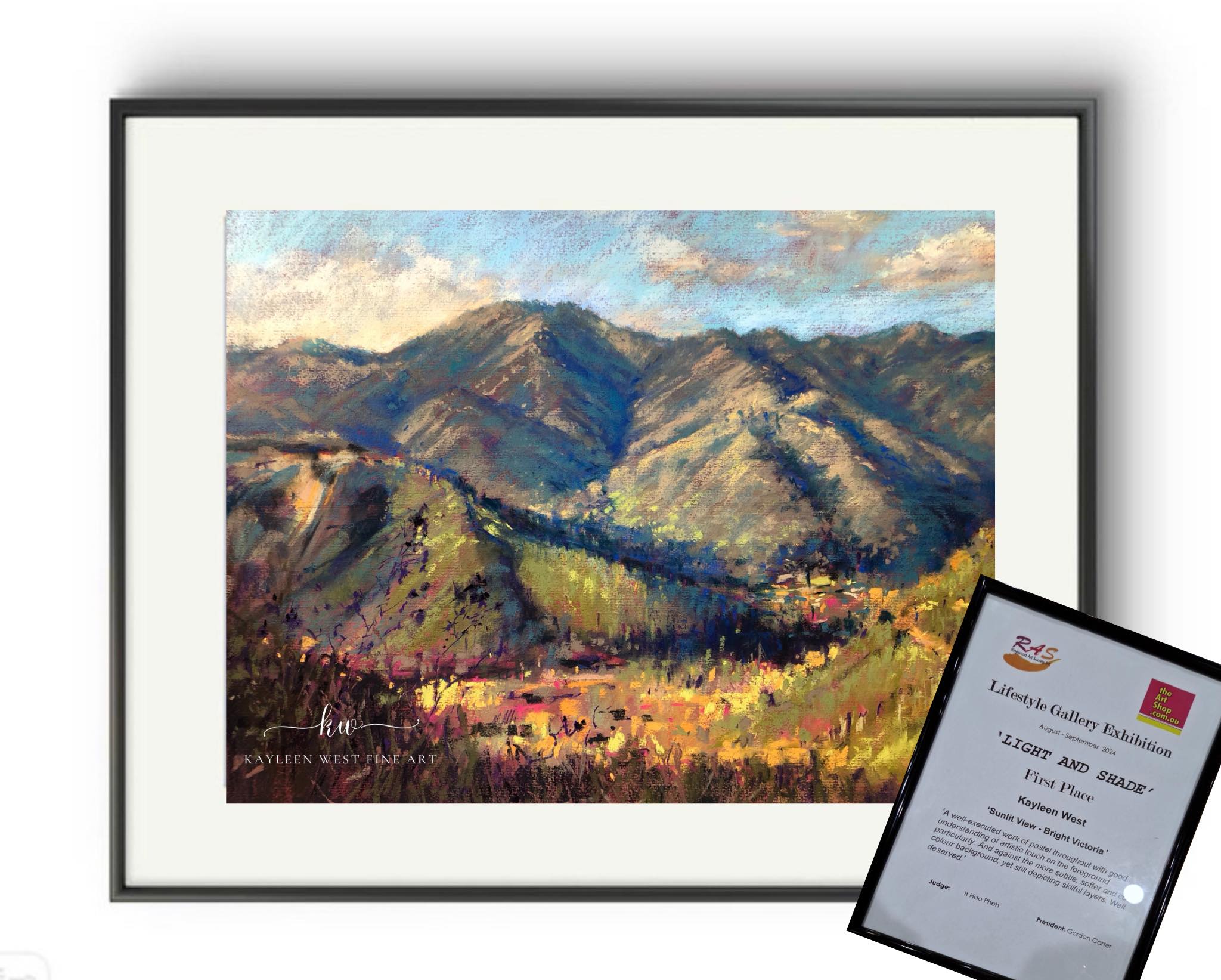 Pastel painting of Bright Victoria mountains with art prize certificate.